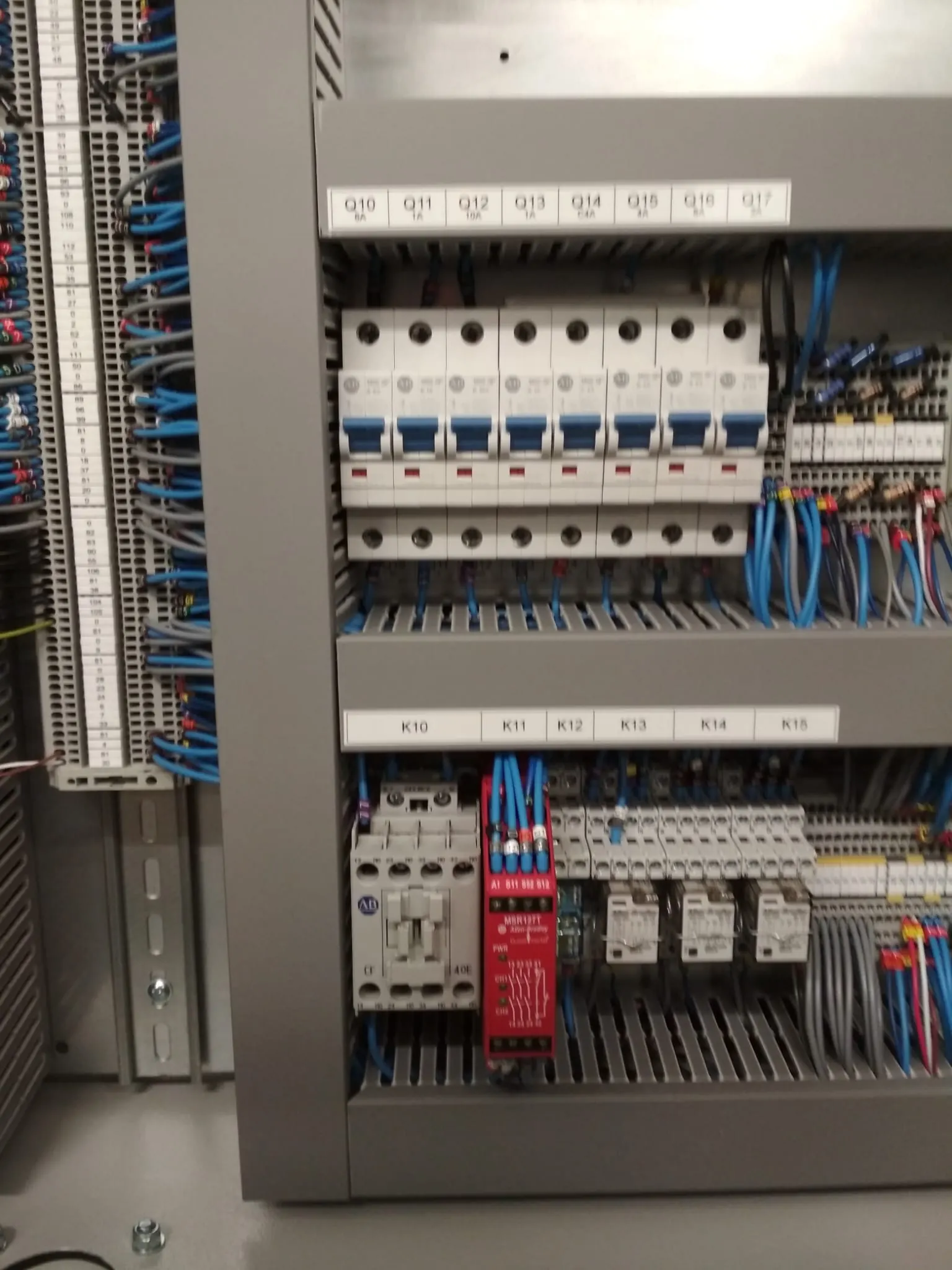 Labelled breakers and relays in a control panel
