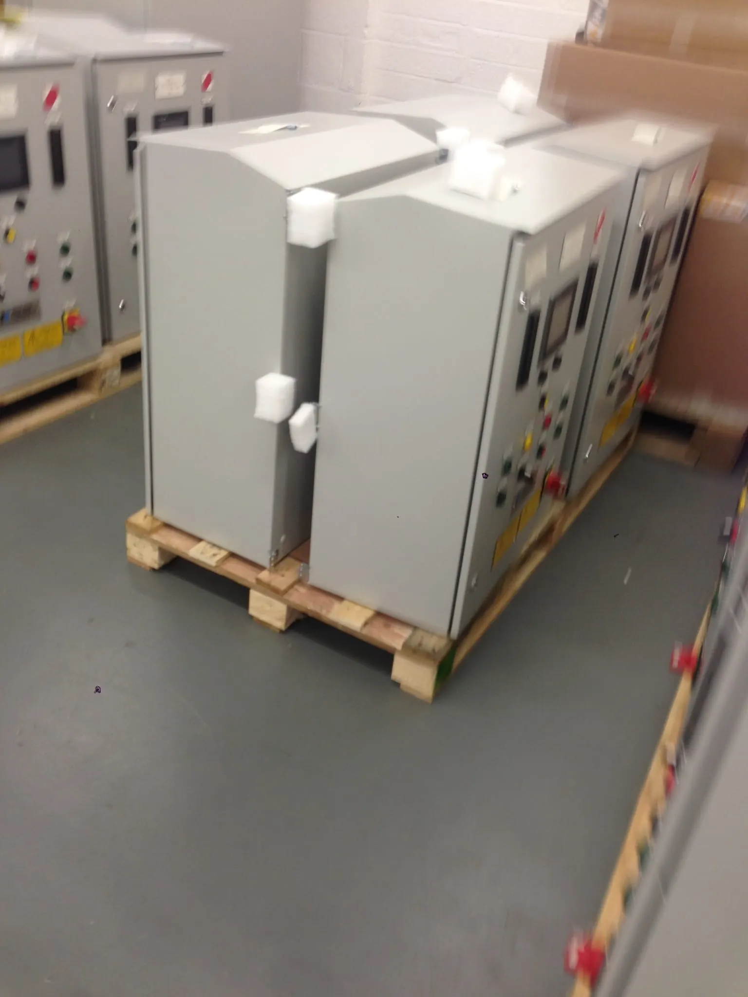 Finished control panels on pallets